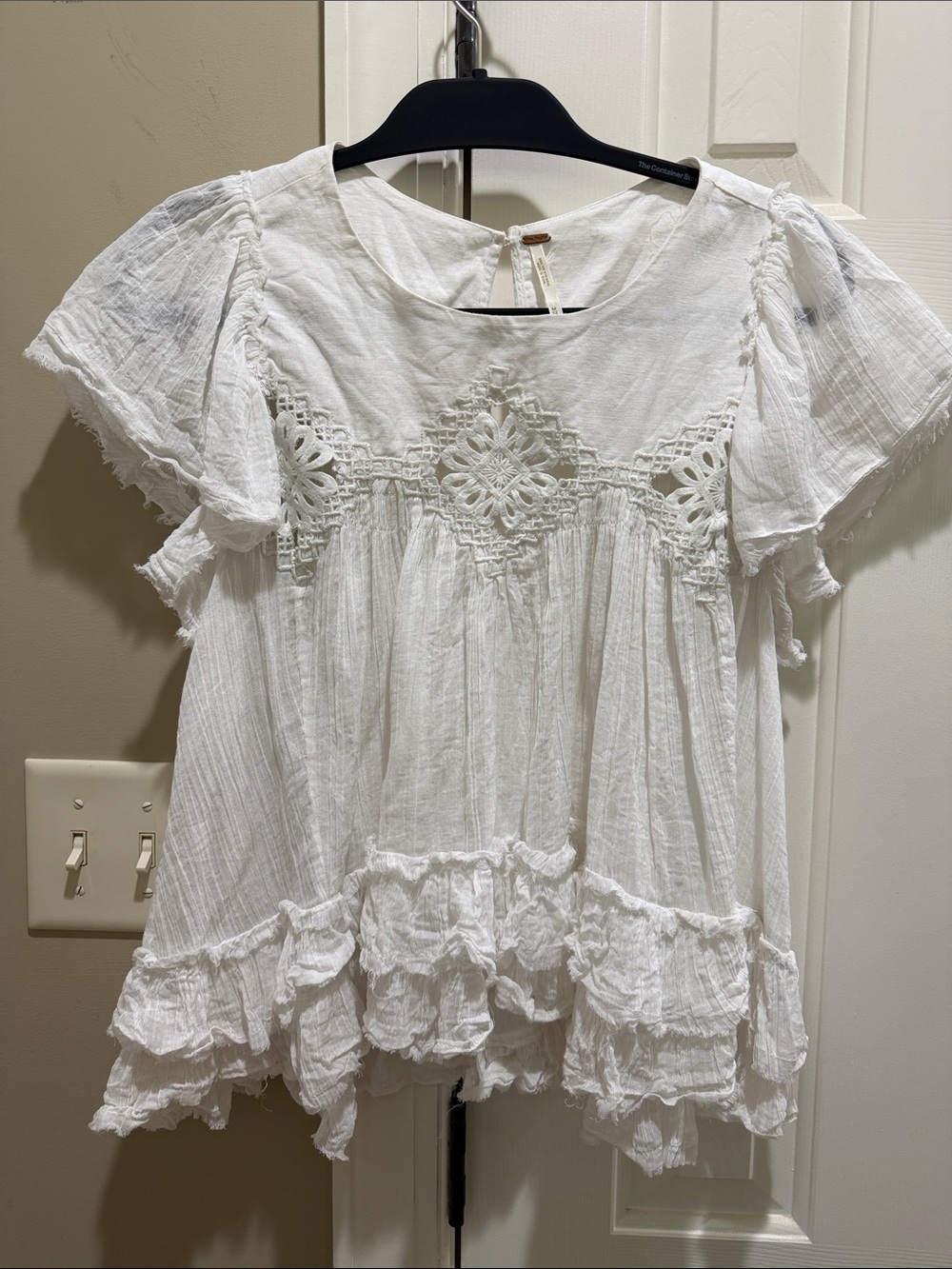 Free People White Crochet-Front and sheer Ruffled Peasant Top. Raw edge bottom